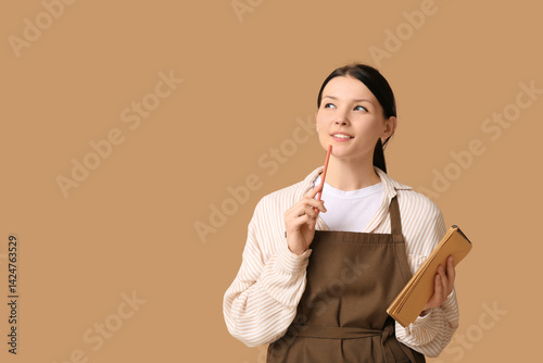 Thoughtful young waitress w...