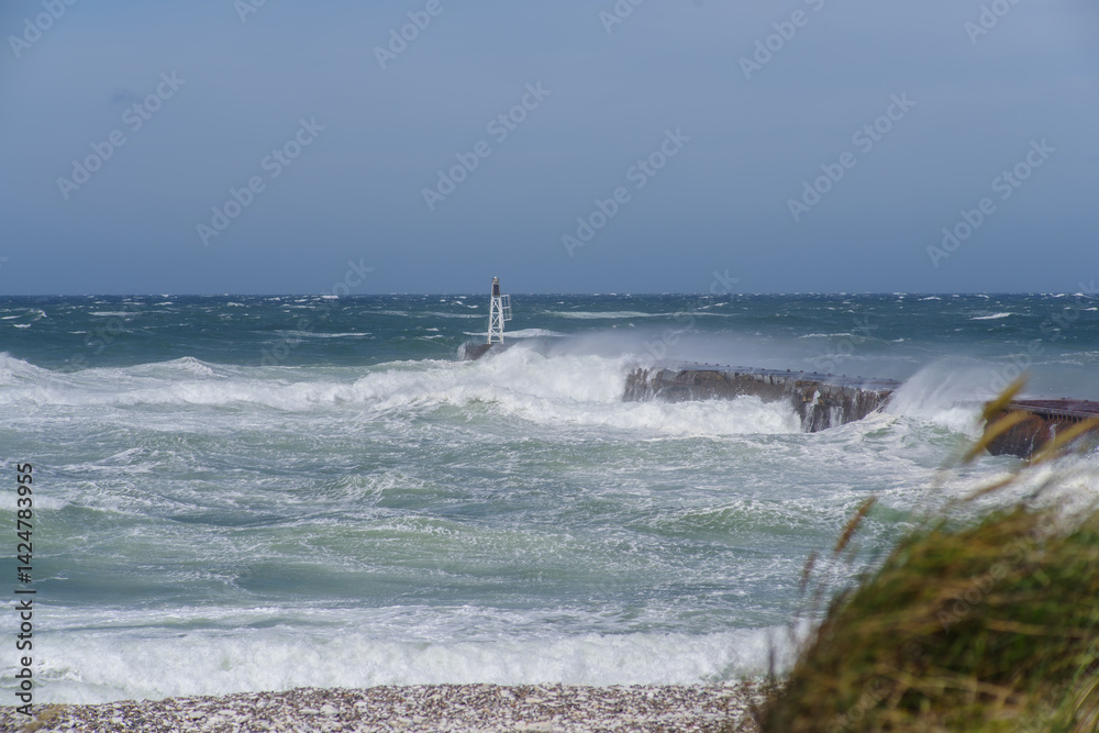 Stormy Sea with Waves Crashing Against Pier and Marker Stormy Sea with Waves Crashing Against Pier and Marker