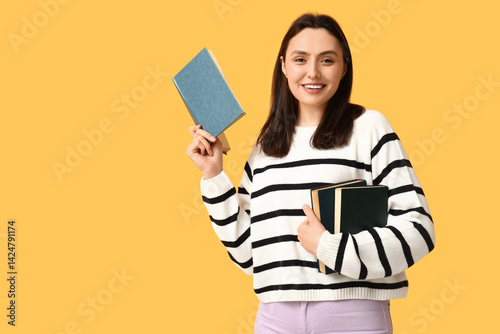 Young woman with books on o...