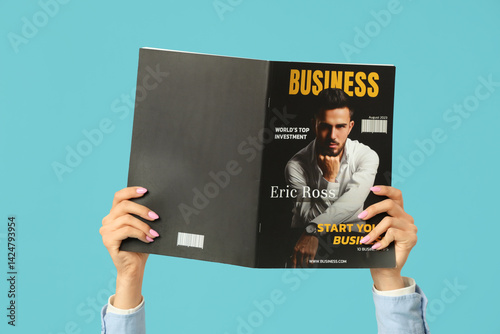 Female hands with magazine ...