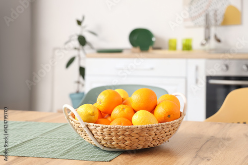 Wicker basket with lemons a...