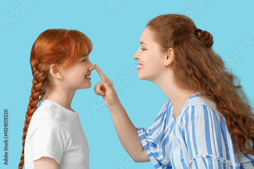 Young ginger woman and her ...