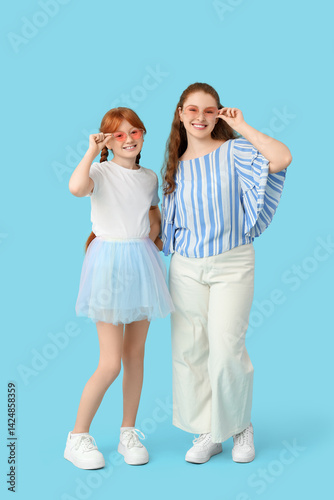 Young ginger woman and her ...