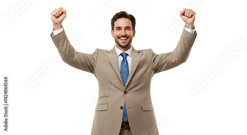 A man in a beige suit and blue tie smiling widely with his arms raised in a victory gesture, white background