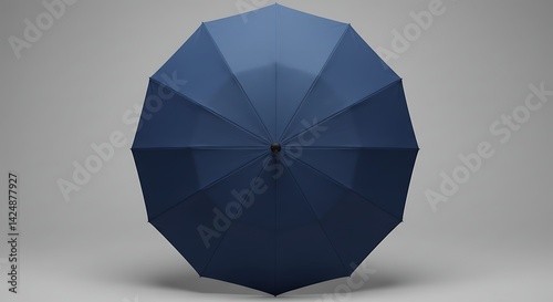 A dark blue, compact foldable umbrella photographed against a horizontal white background. The simple, isolated object stands out with its sleek design and deep color 