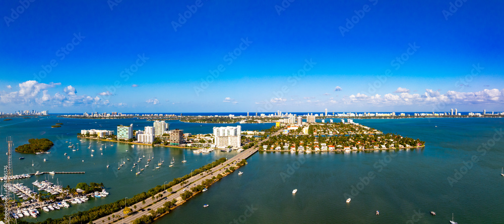 Aerial photo of Miami North Bay Village. Image shows 79th Street bridge and both residential homes and condominiums on several islands