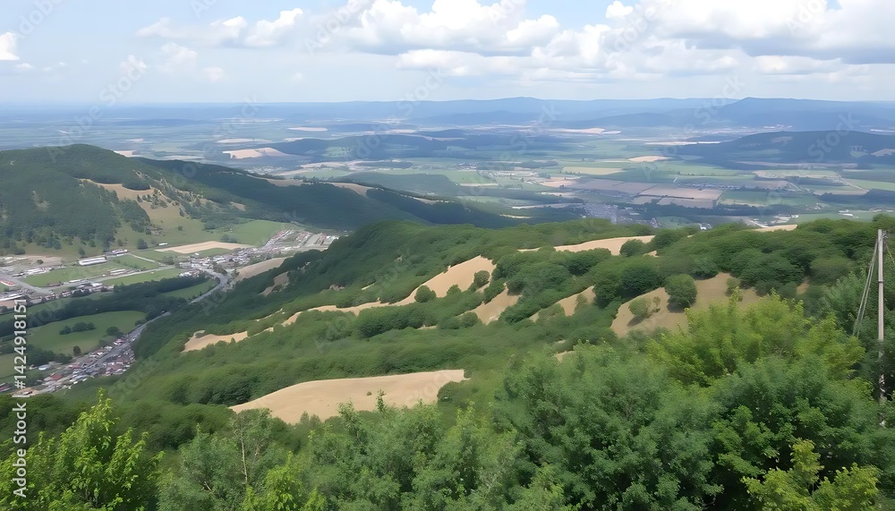 Obraz premium Expansive vista from elevated vantage point showcasing diverse terrain layers