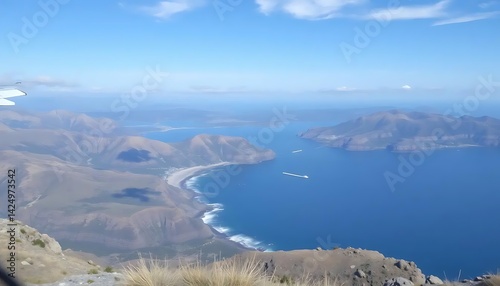 Aerial View of Dramatic Coastline with Mountains and Clear Blue Water
