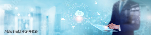 Cloud Computing: Businessman using tablet and analyzing data storage optimization, real-time synchronization, data security, scalability, cloud infrastructure technology on global network. photo