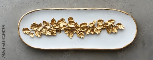 Gourmet sushi plate with golden leaf accents showcasing a minimalist and elegant fine dining presentation  The exquisite culinary artwork features premium Japanese ingredients and a sophisticated
