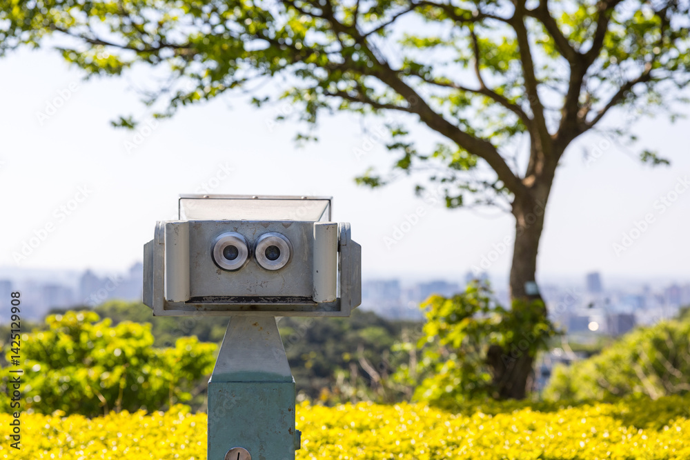 Tourist binoculars on mountain for sightseeing view