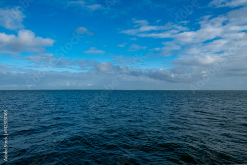 Wallpaper Mural A beautifully serene seascape depicting calm, clear waters alongside a vast blue sky, ideal for tranquil imagery Torontodigital.ca