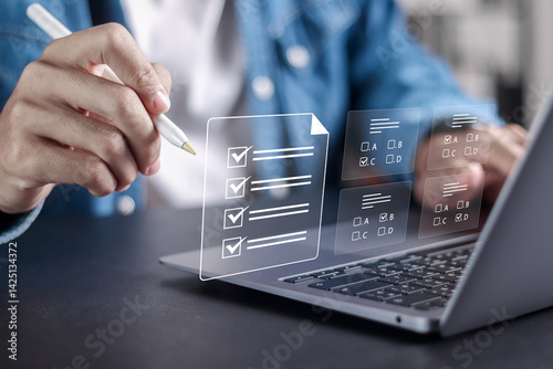Online exam concept, Online education, assessment, questionnaire, evaluation. Person use laptop to choose answers for exam tests.
