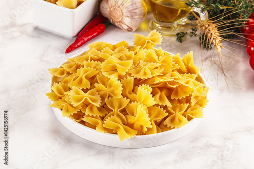 Raw dry Italian pasta - farfalle