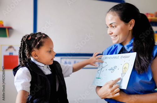 School, Latin kid learning about alternative renewable energy at kindergarten school class. Education concept