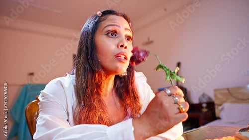 Female musician murmurs a tune eyes locked on floral beauty