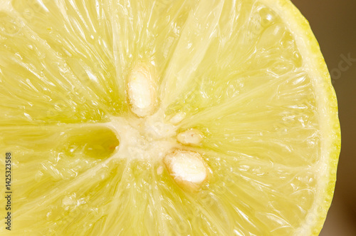 A close up of a lemon with a small hole in the center
