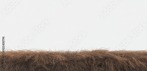 mysterious tuft of hair on top of haystack creates intriguing and whimsical scene against plain background