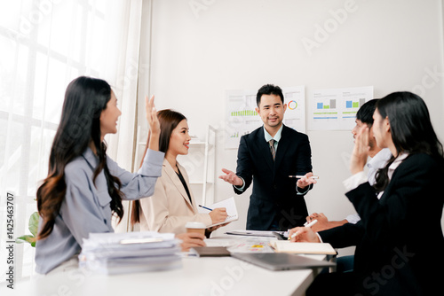 Modern youth are gathering, working as a team, and holding team meetings to achieve their goals.