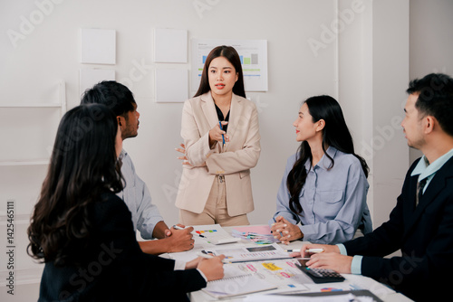 Brainstorming of young modern group. Team meeting to achieve goal. Business people discussing finance business and analysis. Teamwork concept in modern office. Calculating personal tax for client.
