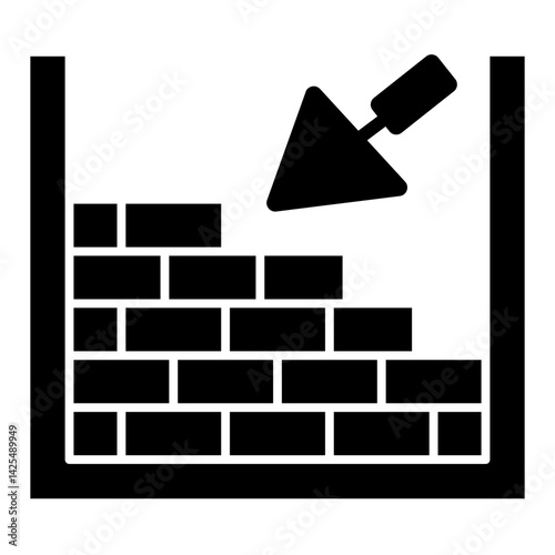 Bricklaying Trowel and Wall