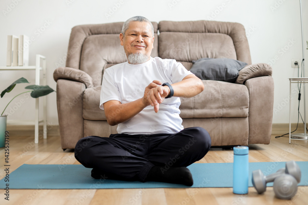 Fototapeta premium Asian Old Man in Sportswear Checking Smartwatch for Heart Rate Tracker App.