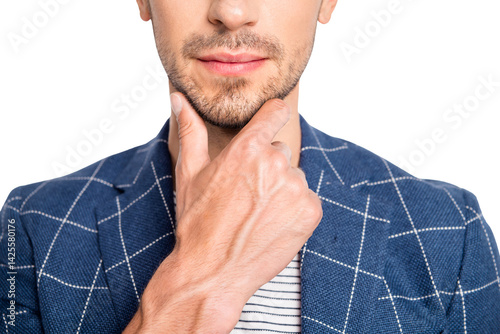 Close-up cropped portrait of his he nice attractive handsome well-groomed businessman dandy metrosexual wearing blue checked blazer touching chin isolated over light white pastel background