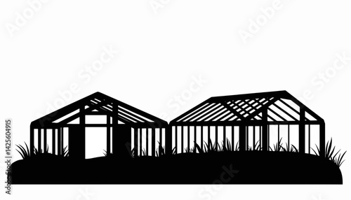 Silhouette of greenhouse construction amid grass, summer home project