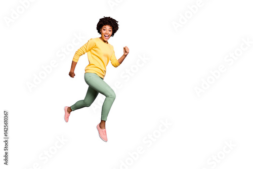 Full length profile side photo of amazed funny crazy afro american girl jump run hurry autumn fall black friday bargain wear green sweater yellow pants trousers isolated violet color background photo