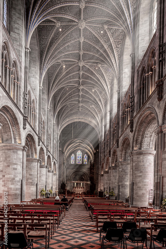 Obraz na płótnie The interior of Hereford Cathedral, Herefordshire, England UK. The sun beams are visible in the incense smoke of the Easter Sunday morning service. w salonie