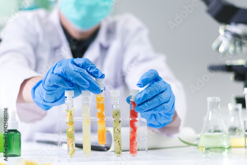Researcher in agriculture used technology scientific to test fruit and vegetable samples in a tube, ensuring food quality and advancing modern farming innovations.