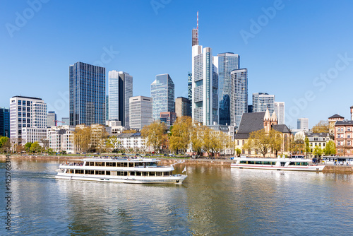 Obraz na płótnie Frankfurt skyline skyscrapers with banks on River Main with excursion boats in Frankfurt, Germany w salonie