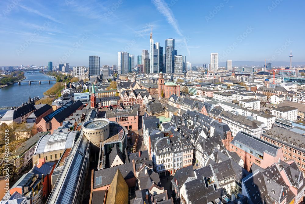 Frankfurt skyline skyscrapers in city center with the Römer and Main river from above in Frankfurt, Germany