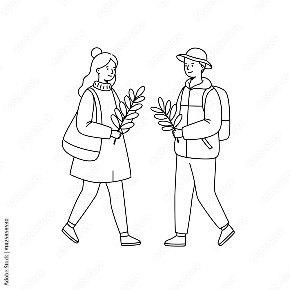 Fototapeta premium Couple collecting leaves in the park during autumn 