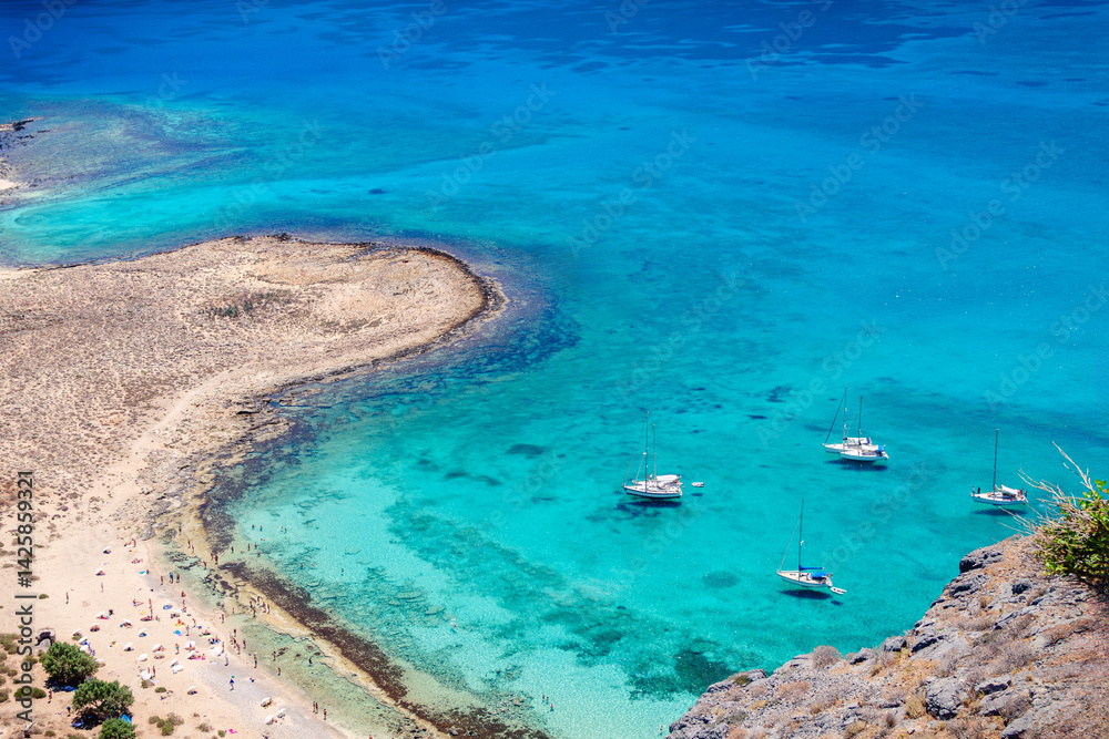 Relaxing beach day with sailboats at a beautiful coastal location