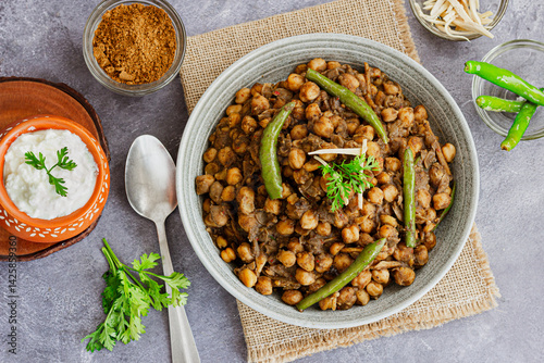 Spicy Indian Chickpea Masala Top Down Photo with Spices and Cilantro
