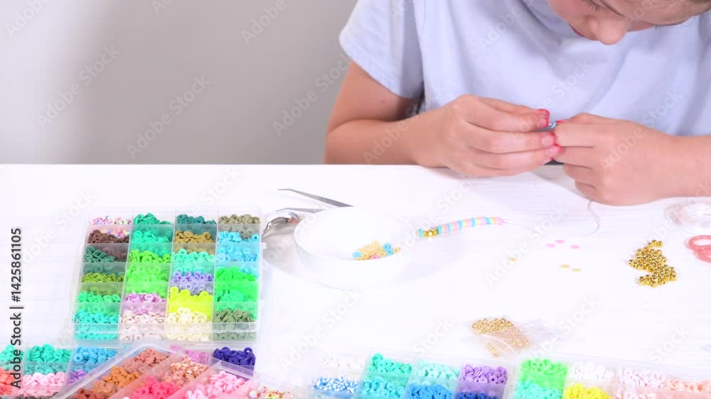 Young Girl Engrossed in Crafting with Colorful Clay Beads Young Girl Engrossed in Crafting with Colorful Clay Beads