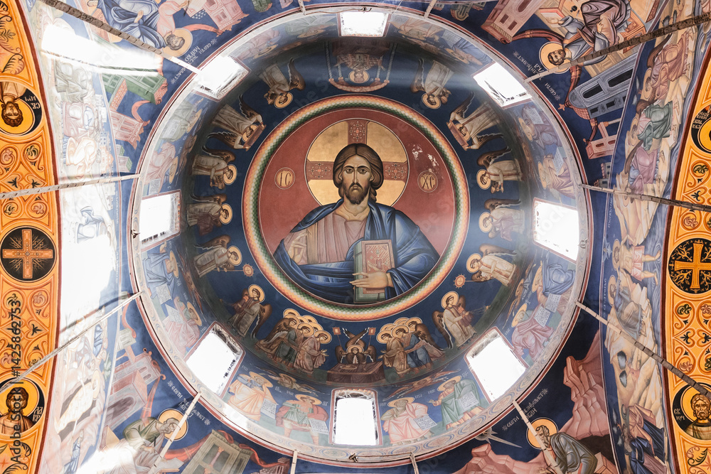Obraz premium Ornate Church Dome with Religious Frescoes and Central Jesus Image