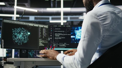 Data center computer scientist at desk using AI deep learning algorithms to analyze datasets. Server room IT specialist typing on PC keyboard, using artificial intelligence neural networks, camera A