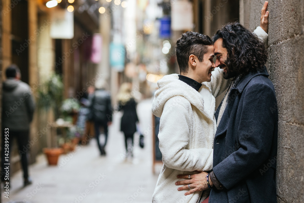 Fototapeta premium Gay couple sharing a romantic moment in a city street