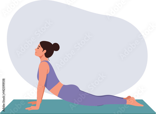 Woman practicing upward dog yoga stretch on mat in fitness exercise pose 