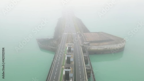 Wallpaper Mural Foggy morning over the massive dam in northern France, cars driving, 4k Torontodigital.ca