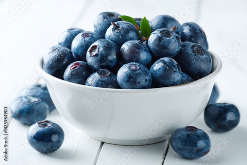 Wallpaper Mural Fresh blueberries in a ceramic bowl highlight vibrant textures on a clean white table for a refreshing snack Torontodigital.ca