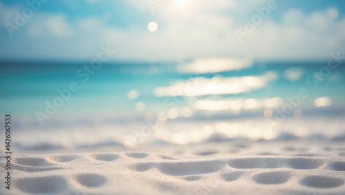Fototapeta Naklejka Na Ścianę i Meble -  Scenic panorama of a pristine white sand beach with vibrant turquoise water and a calm sea and sky in the background.