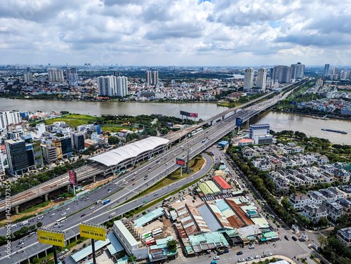 Ho Chi Minh, Vietnam - Sept 30, 2023: Overhead view of Tan Cang Station on Metro Line 1 beside the Hanoi Highway and Saigon River, connecting Bình Thạnh with Thu Duc City.