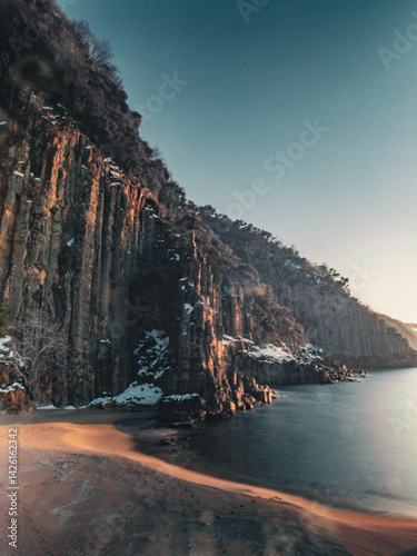 image of basalt columns in winter snow