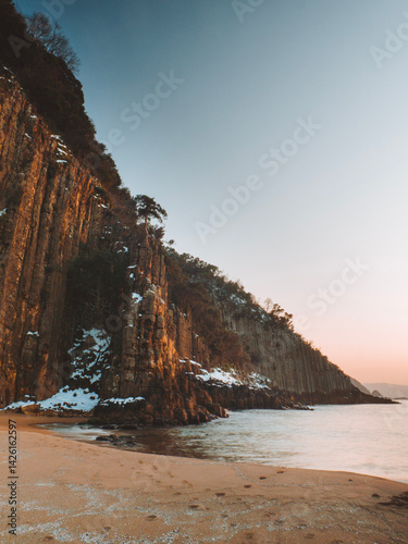 image of basalt columns in winter snow