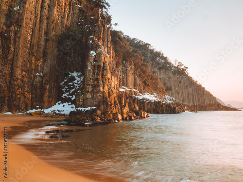 image of basalt columns in winter snow