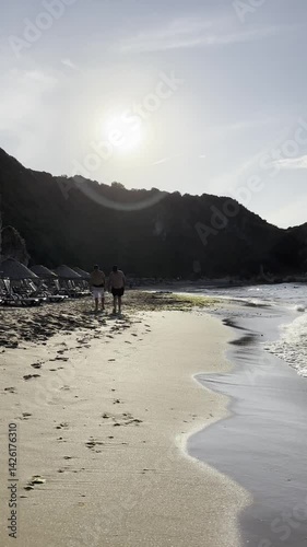 Walk on the beach scene with blue sky, clouds and rocks in the sea, Sile, Turkey. Black Sea view