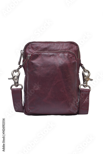 Maroon leather crossbody bag with zippered pockets and metallic details fashionable style . Cut out isolated on white background